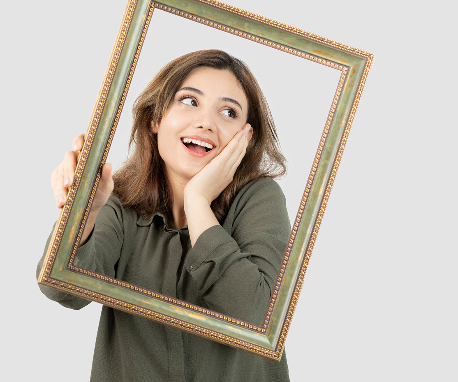 Young adorable female model posing in middle of empty frame. High quality photo